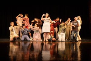 A group of individuals dance.